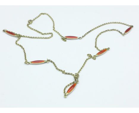 A white metal and enamel necklace