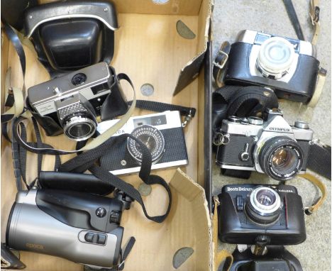 A collection of cameras, Olympus OM1, Canon Epoca video camera, etc.