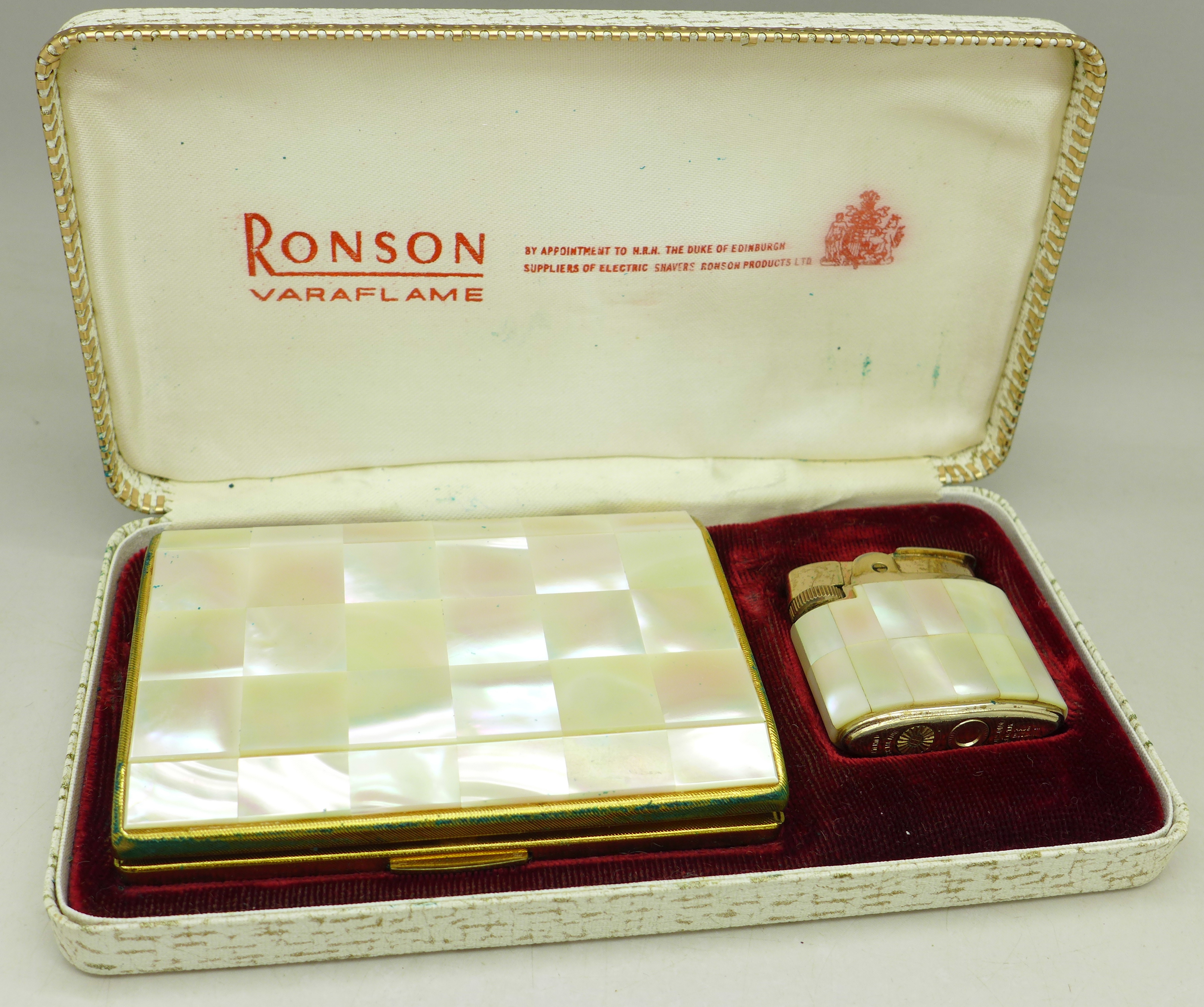 A Ronson Varaflame cigarette lighter and cigarette case decorated with