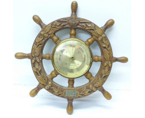 A barometer in the form of a ship's wheel