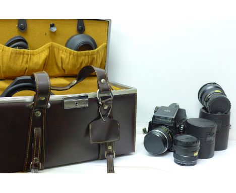 A Mamiya 645 medium format camera and three lenses, with carry case, Mamiya-Sekor 1:28 f=110mm, 1:2.8 f=80mm, and 1:2.8 f=45m