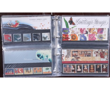 One album containing approx. forty-four mint stamp presentation packs and greetings stamps 1994-1998, estimated FV £85.