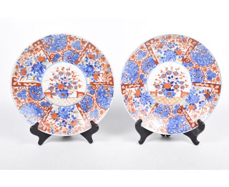 A pair of Japanese Imari wall plaques, 20th CenturyEach decorated in typical shades of blue and red with a central circular p