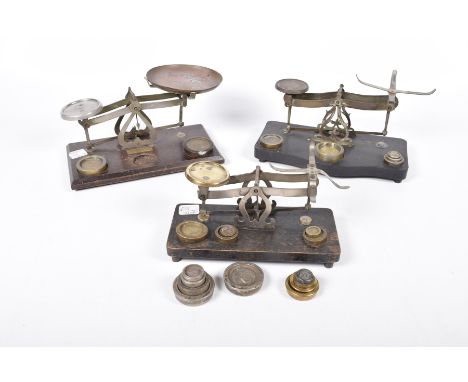 Three sets of postal weighing scales, early 20th centuryOne example by Johnsons of Hendon, together with a collection of bras