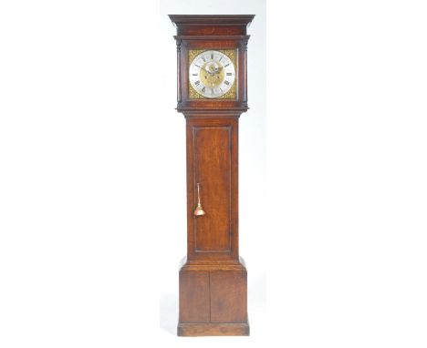 The mid 18th century oak cased thirty hour long case clock by Stringer of StockportHaving a two tier moulded cornice above ri