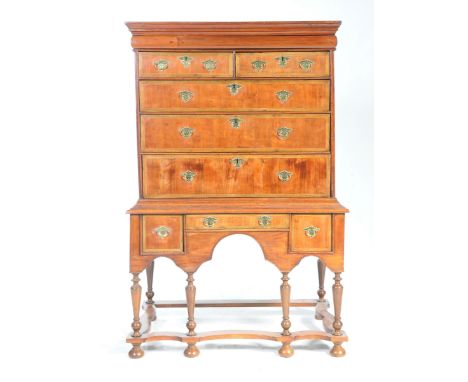 A rare and impressive yew wood chest on stand, late 17th, early 18th centuryHaving a moulded cornice above a convex secret dr