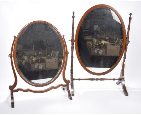 Two Georgian style mahogany dressing table mirrorsThe largest with an oval plate supported on ring turned uprights with down 