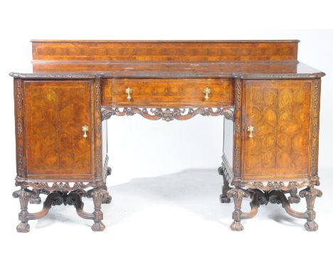 An 18th Century style oyster walnut sideboard, early 20th CenturyWith a shaped inverted break front top above a central friez