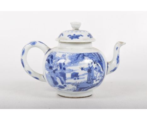 A Chinese blue and white teapot, Qianlong period, (1735-1796)Of globular form with domed cover, short spout and loop handle, 