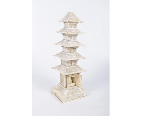 A Chinese carved bone travelling shrine, late 19th/early 20th CenturyThe five tiered carved and stained pagoda, above hinged 