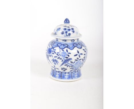 A Chinese blue and white jar and cover, 19th CenturyOf baluster form, surmounted by a domed cover with flower bud finial, dec