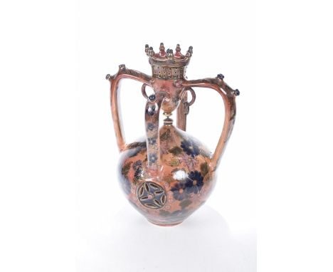 Unusual continental glazed pottery vase, mid-20th centuryA 33cm high vase with four splayed arms with metal ring ornaments, d