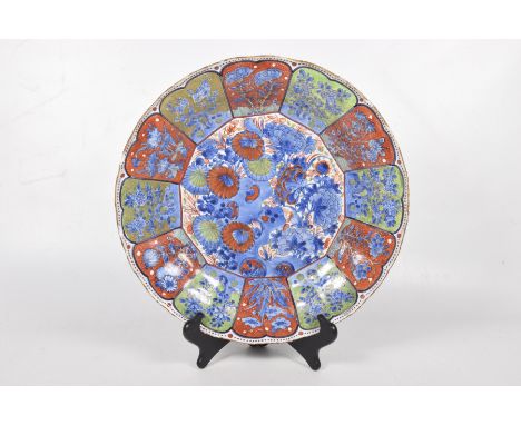 A Chinese enamelled charger, 19th/20th CenturyOf circular form with shallow well and lobed edge, the central panel detailed w