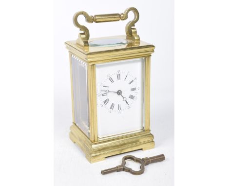 A brass-framed and bevelled glass carriage clock, 20th centuryThe 6x9cm white dial with black Roman and Arabic numerals, comp