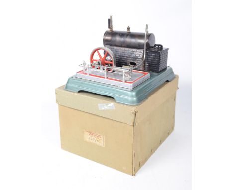 A Fleischmann model steam engine, mid to late 20th centuryThe steam engine mounted on a green painted stand with attached fly