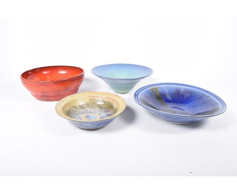 Four Studio pottery bowlsTo include a shallow mottled blue example, impressed mark V R, a second similar bowl also impressed 