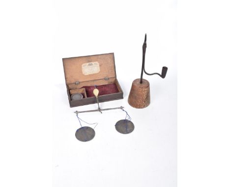 An antique wrought iron rush light mounted on a wooden baseHeight 33.5cm, oak boxed set of scales, with paper label with the 