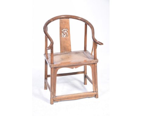 A Chinese hardwood Huanghuali style elbow chairHaving a horseshoe shaped top rail with outswept terminals above a splat centr