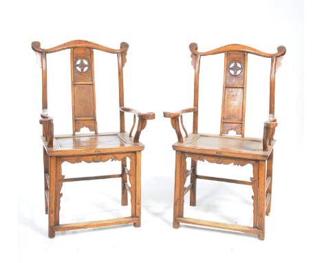 A pair of Chinese hardwood Huanghuali style elbow chairsEach with a yoke top rail with scroll terminals above a curved splat 