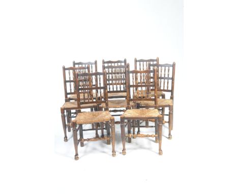 A set of eight Lancashire spindle back ash and beech kitchen chairs, late 19th early 20th CenturyEach chair with two rows of 