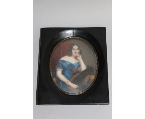 A GOOD OVAL PORTRAIT, THREE QUARTER LENGTH OF A YOUNG LADY seated in a chair, blue dress, her hair in ringlets. 5.25ins x 4in