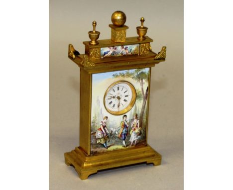 A GOOD SMALL GILT METAL AND VIENNA CLOCK, the front decorated with figures in a garden setting.  5ins high.