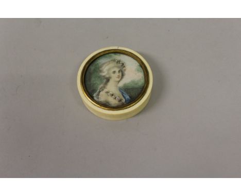 A GEORGIAN CIRCULAR IVORY BOX, the lid with a portrait of a young lady. 2.75ins diameter,