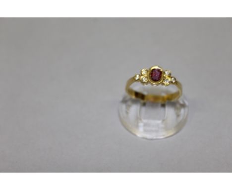 AN 18CT YELLOW GOLD, DIAMOND AND RUBY RING.