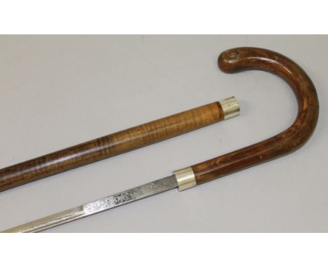 A WOODEN SWORD STICK WITH SILVER BAND.  34ins long.