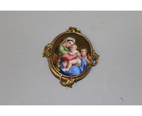 A CONTINENTAL ENAMEL OVAL BROOCH "MADONNA AND CHILD" in a gold mount.