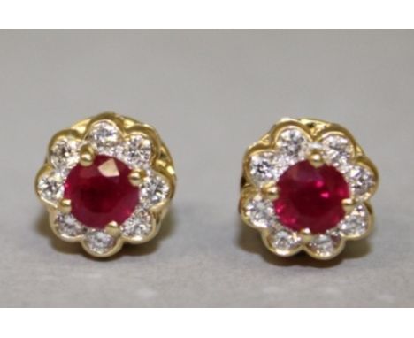 A GOOD PAIR OF 18CT YELLOW GOLD, RUBY AND DIAMOND FLOWER HEAD CLUSTER EARRINGS.