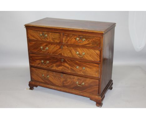 A GEORGE III MAHOGANY STRAIGHT FRONT CHEST of two short and three long graduated drawers, supported on ogee bracket feet.3ft 