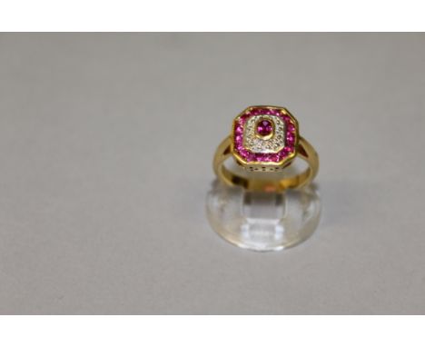 A GOOD RUBY AND DIAMOND CLUSTER RING set in 18ct yellow gold.