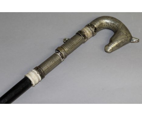 AN ISLAMIC EBONY WALKING CANE SWORD STICK with silver and ivory handle as a horse's head.