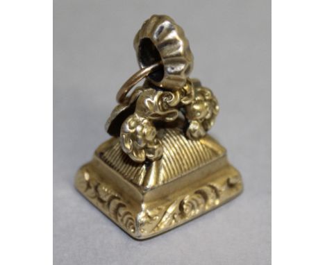 A GEORGIAN GOLD FOB SEAL, the rectangular cornelian intaglio incised with a male portrait profile, with foliate scroll surmou