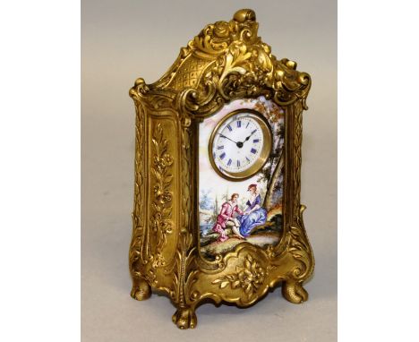 A GOOD SMALL GILT METAL AND VIENNA VITRINE SHAPED CLOCK with blue and white Roman numerals, the front with a Vienna panel of 