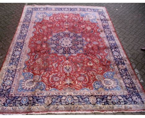 A good large Kashan carpet, central red ground field with stylized decoration. 12ft 10ins x 9ft 6ins.