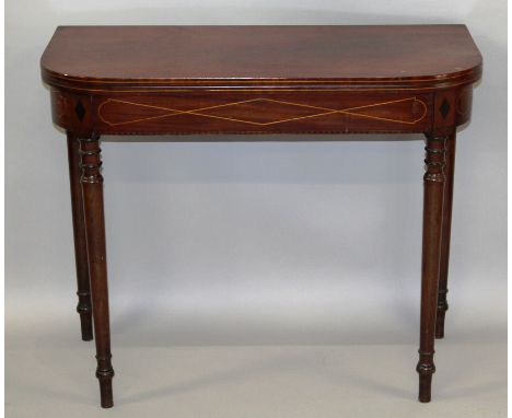 A 19TH CENTURY "D" SHAPE MAHOGANY FOLD-OVER CARD TABLE with box wood and ebony inlay, on turned legs.3ft 0ins wide x 2ft 5ins