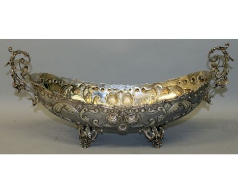 A GOOD LARGE CONTINENTAL TWO HANDLED BOAT SHAPED BASIN with repouss decoration on four pierced feet.Stamped .835. Weight 28oz