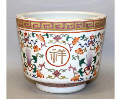 A CHINESE FAMILLE ROSE PORCELAIN JARDINIERE, the sides decorated with auspicious characters reserved on a formal ground of va