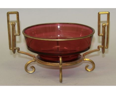 A FRENCH RUBY GLASS CIRCULAR BOWL in a brass mount and stand.6ins diameter.