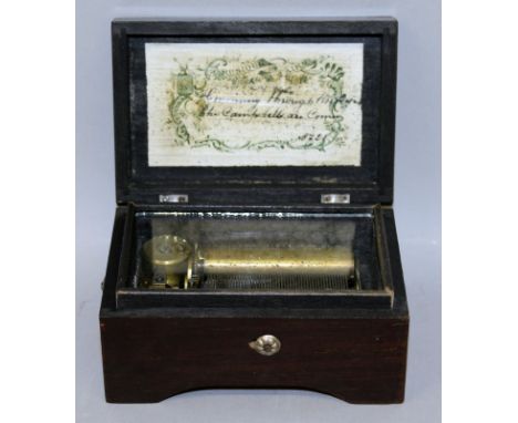 A SMALL SWISS MUSICAL BOX in a mahogany case playing "Coming Through the Rhine" and "The Campbells are Coming". 4.75ins wide.