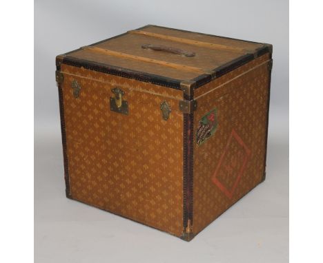 A FRENCH LEATHER AND BRASS BOUND SQUARE SHAPE TRAVELLING TRUNK with lifting lid and removable inner tray.2ft 0ins wide x 2ft 