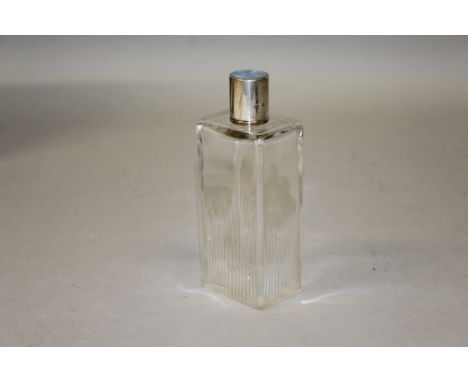 A GLASS SCENT BOTTLE with silver and blue enamel top.London 1946.