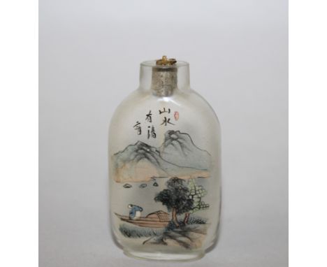 AN EARLY 20TH CENTURY CHINESE INTERIOR PAINTED GLASS SNUFF BOTTLE, painted with river landscape scenes, calligraphy and a red