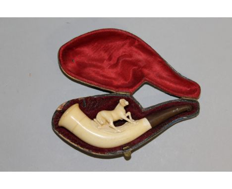 A CARVED IVORY MEERSCHAUM PIPE, carved with a horse, in its original case.  4ins long.