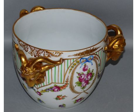 A DRESDEN CIRCULAR JARDINIERE painted with flowers with three rams mask handles.  6.5ins high.