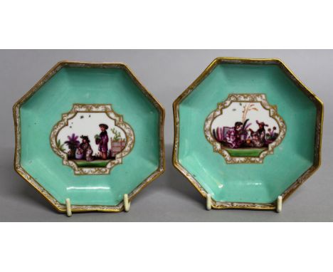 A PAIR OF MEISSEN OCTAGONAL SAUCERS decorated with scenes of Chinese figures.  4.25ins.