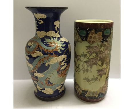 An oriental ceramic stick stand with a large oriental vase, 54cm tall (hole to base of stickstand).