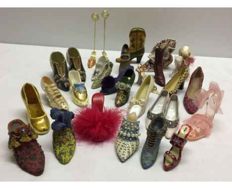 A collection of miniature shoes to include crested ware and Royal Worcester.
